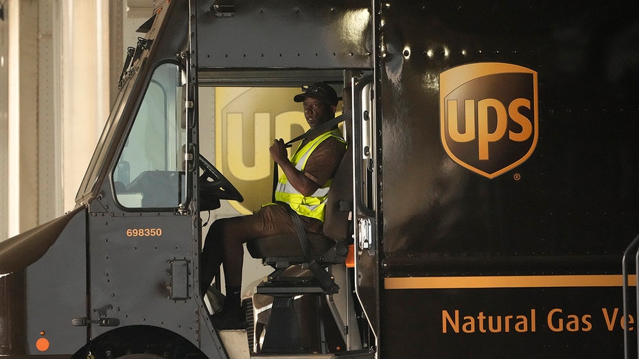 UPS driver is seen in truck as company and Teamsters reach tentative agreement