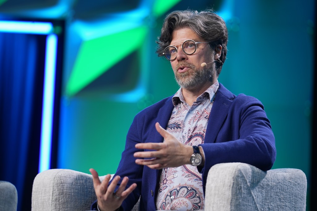 SAN FRANCISCO, CALIFORNIA - APRIL 06: Bryan Catanzaro speaks onstage during the "AI is a 5 Layer Cake" panel at the HumanX Conference San Franciso 2026 at Moscone Center South on April 06, 2026 in San Francisco, California. (Photo by Big Event Media/Getty Images for HumanX Conference)